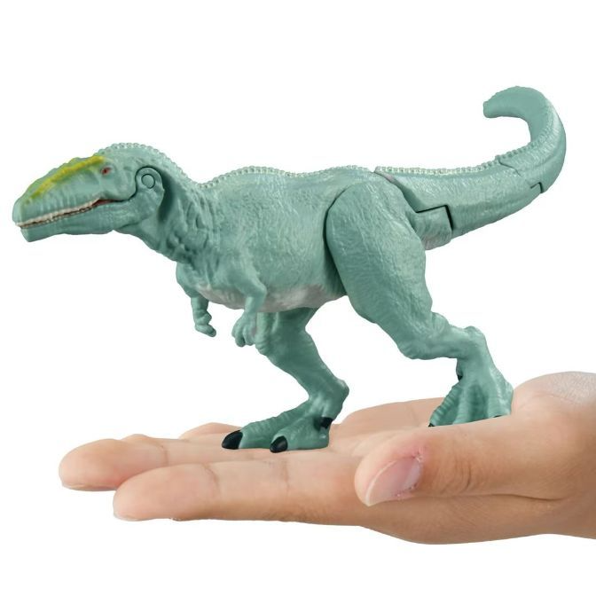  Blue dinosaur toy with yellow stripe on hand.