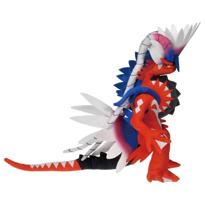  Koraidon plush toy, red with white, blue, and black accents, standing.