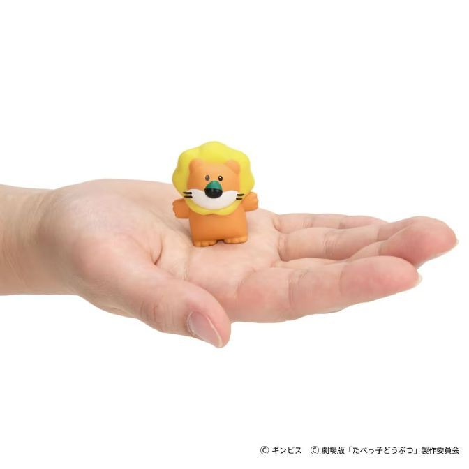  Lion toy figure with yellow mane on a hand.