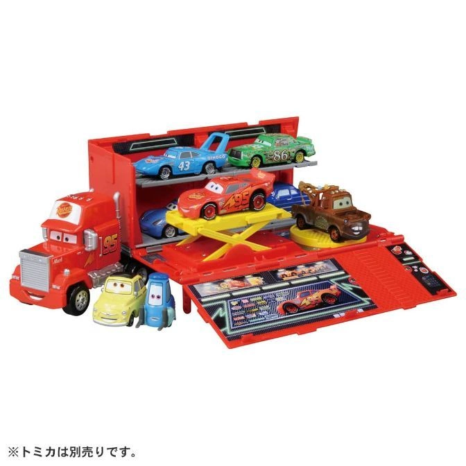  Cars Mack truck playset with Lightning McQueen, Mater, and other character cars on display.