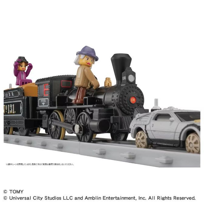  A toy train with figures of Doc Brown and Clara Clayton from Back to the Future III, alongside a DeLorean car.