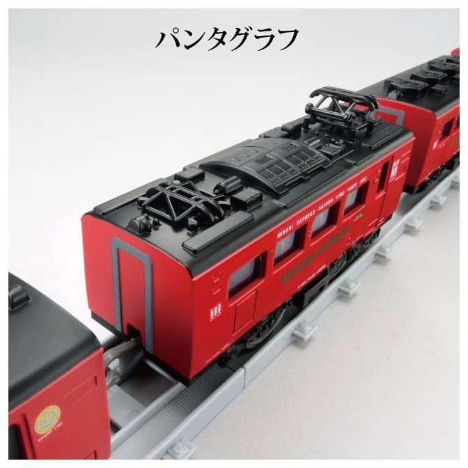  Red toy train with black roof and pantograph on grey tracks. "Midori Express" is printed on the side.