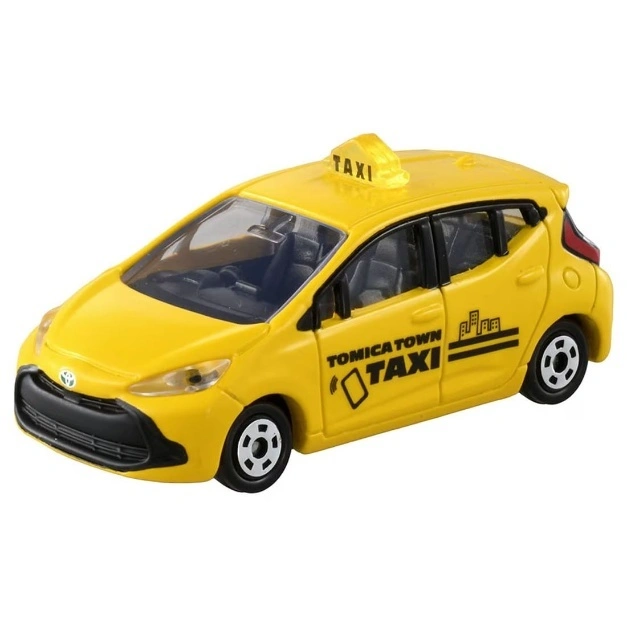  Yellow toy taxi car with 'TAXI' sign on top and 'TOMICA TOWN' logo on the side.