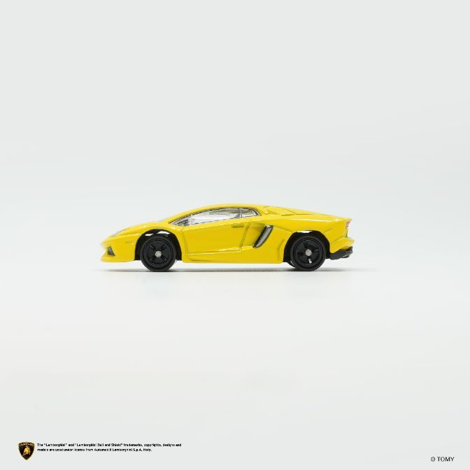  Yellow Lamborghini Aventador toy car, side view, black wheels.