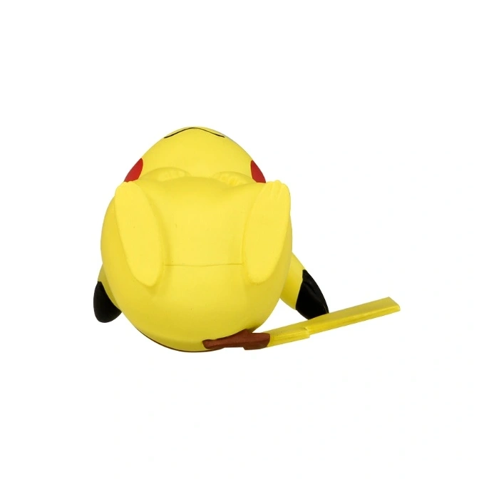  Yellow Pikachu toy lying on its back with its tail sticking out.