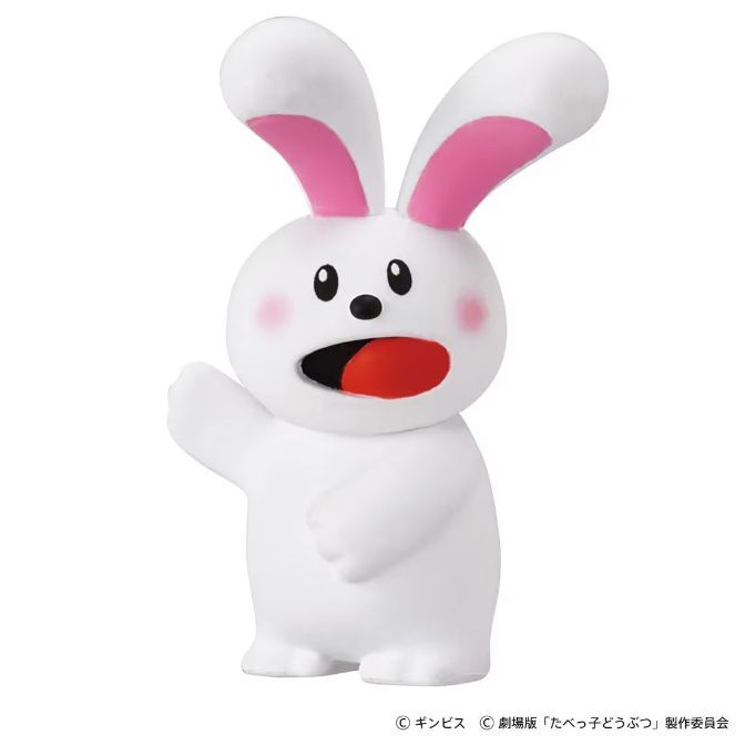 White rabbit toy with pink ears and cheeks, mouth open.