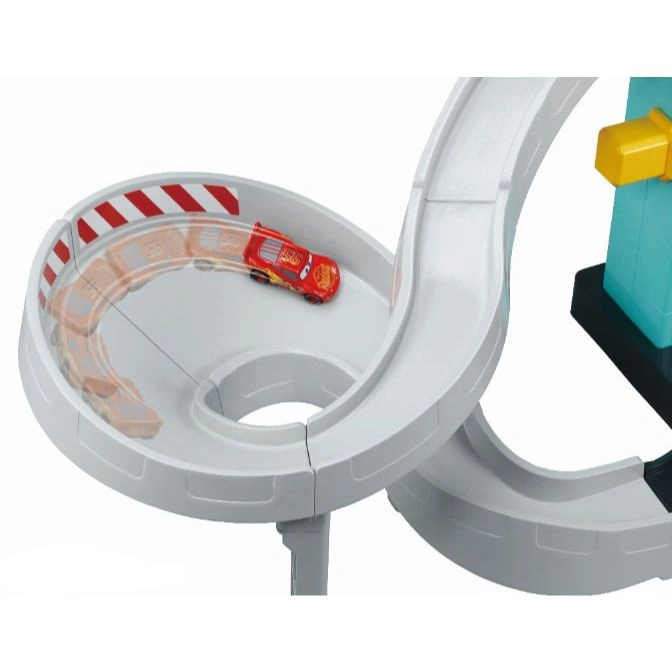  Toy race track with Lightning McQueen car racing around a loop-de-loop.