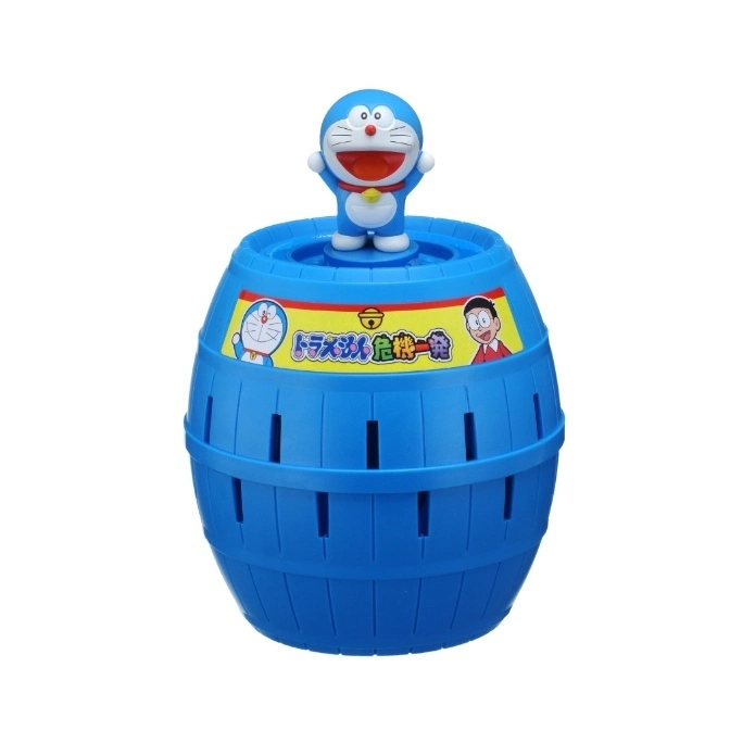  Doraemon figure on a blue barrel toy with slots and a yellow label featuring Doraemon and Nobita.