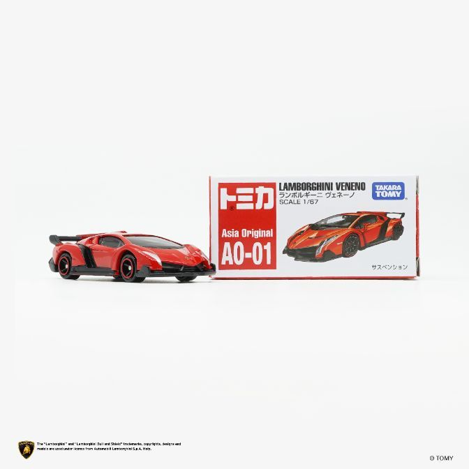  Red Tomica Lamborghini Veneno toy car next to its box. Scale 1/67.