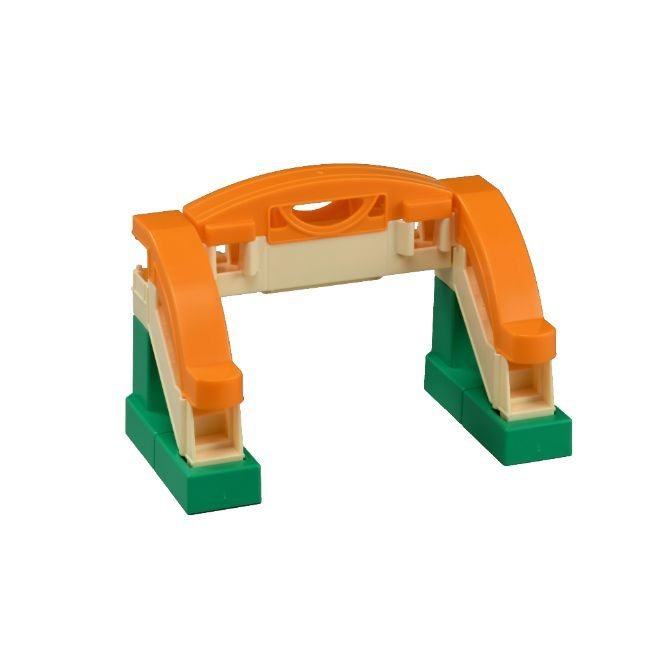 A toy bridge made of green, orange, and beige plastic.