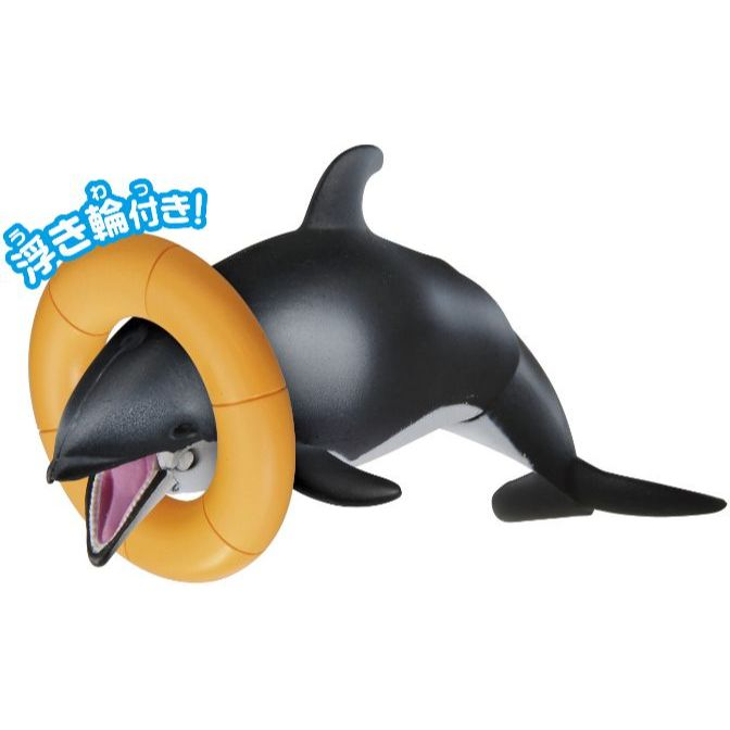  Toy orca with orange floatie around its head, mouth open.