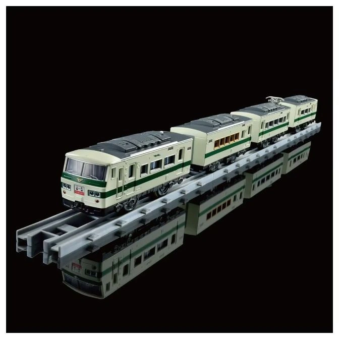  Toy train set with four cars on gray tracks, reflected on a black surface.