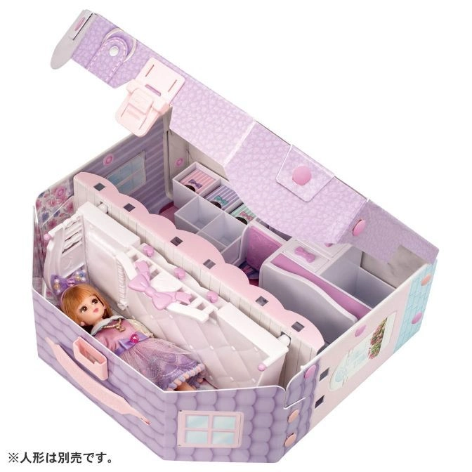  Open dollhouse playset with doll inside, featuring furniture and storage compartments.