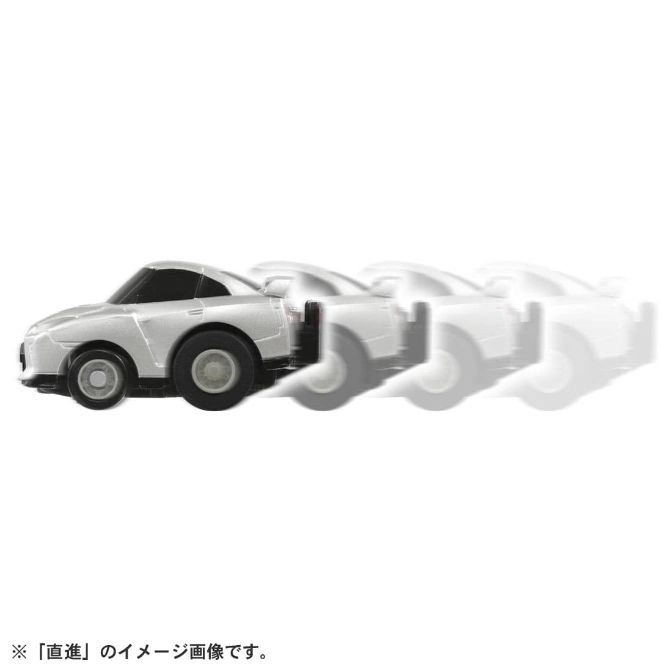  Silver toy car in motion, showing a blurred trail of movement.