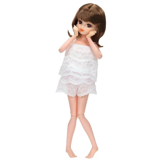  Doll with brown hair in white lace top and shorts, hands on cheeks.