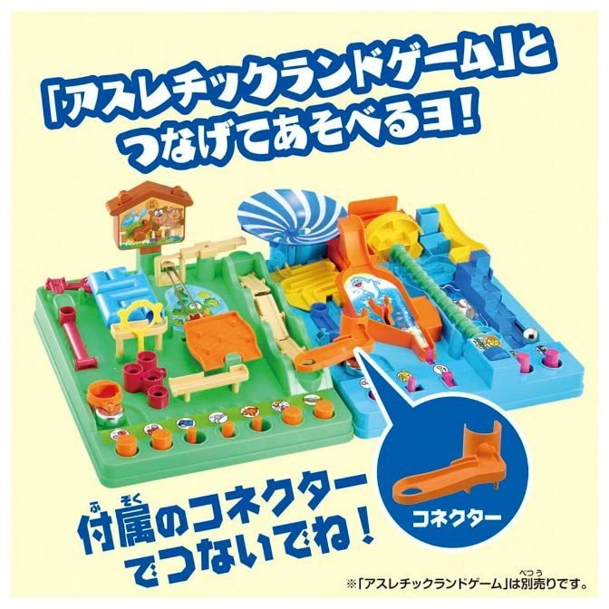 Toy marble run with green & blue sections, ramps, slides, & obstacles. An orange connector piece is highlighted.