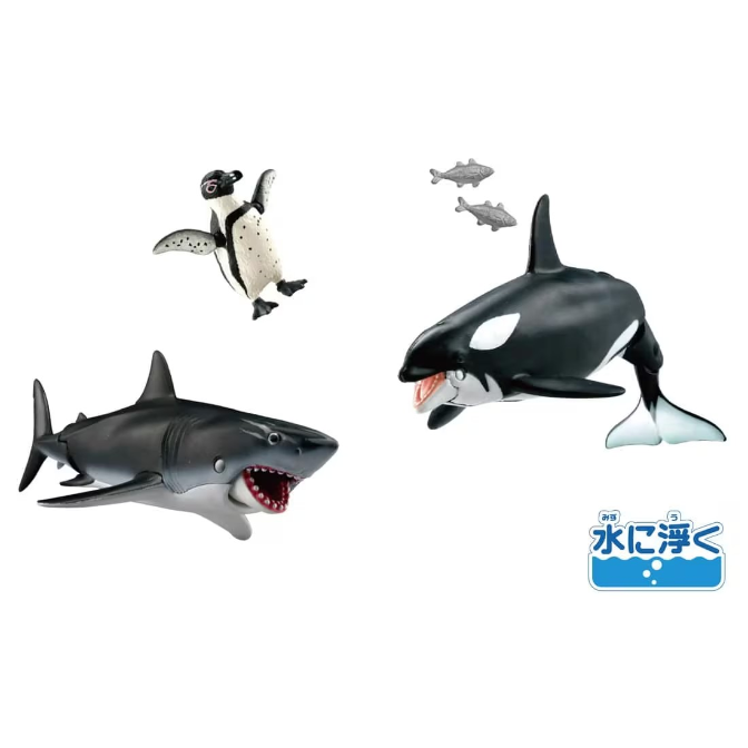 Toy set with shark, orca, penguin, and fish figures. The shark and orca have open mouths.