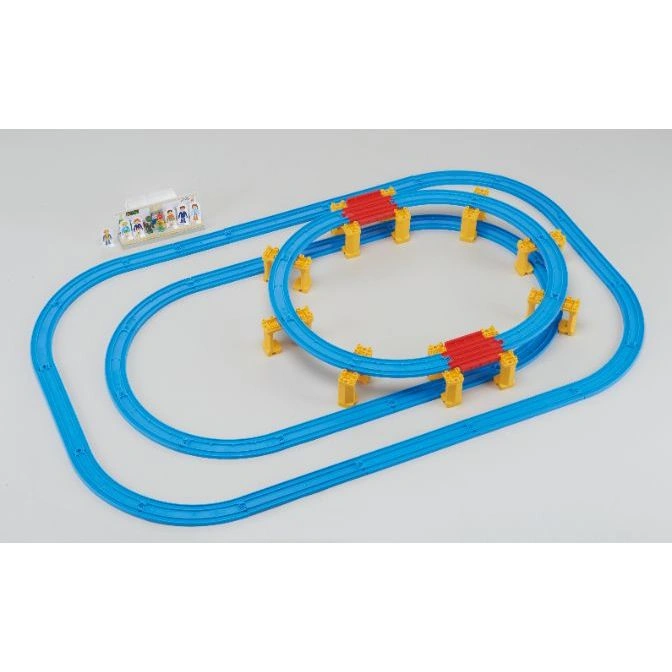  Toy train set with blue tracks, yellow supports, red bridges, and a station with figures.