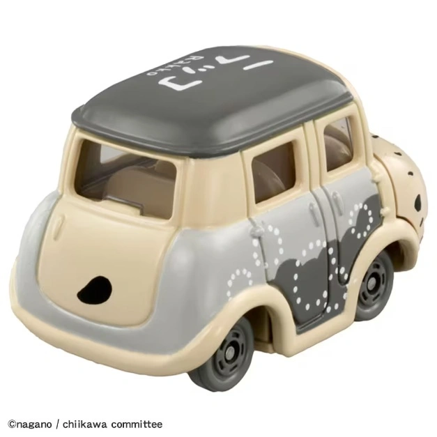  Beige and gray toy car with cartoon design and black wheels.