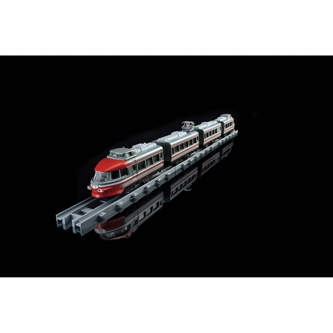  Red and silver toy train on a gray track, reflected on a black surface.