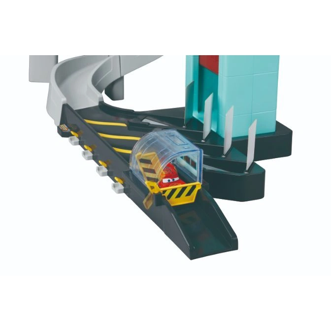  Cars playset with Lightning McQueen in a clear tunnel on a black track with yellow stripes and a blue building.