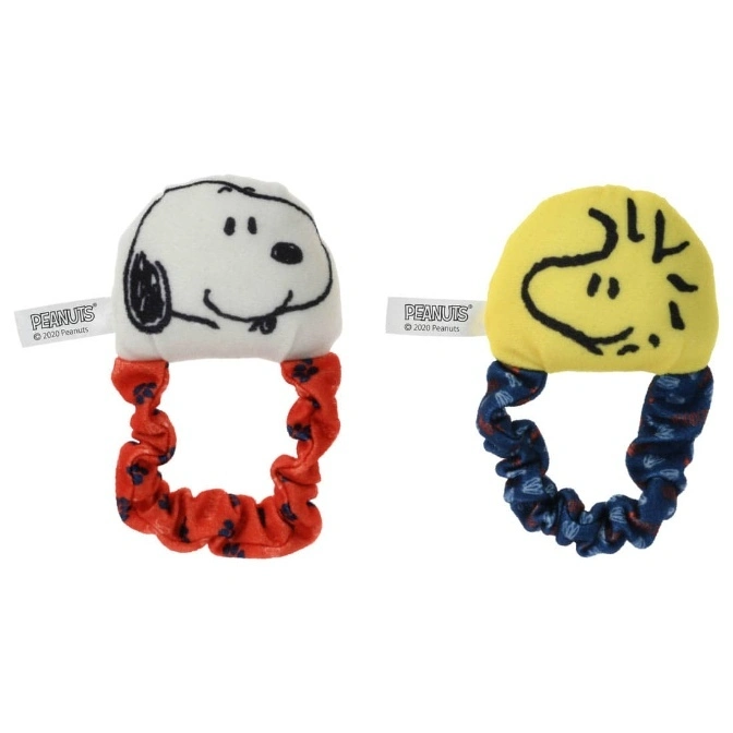 Snoopy and Woodstock plush wrist rattles with colorful scrunchie bands.