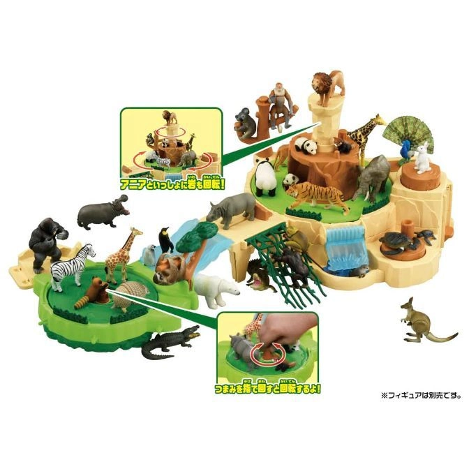  Animal playset with rotating platforms, waterfall, and various toy animals like lions, giraffes, and kangaroos.
