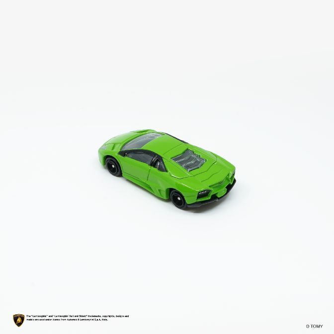  Green toy Lamborghini sports car with black wheels on a white background.