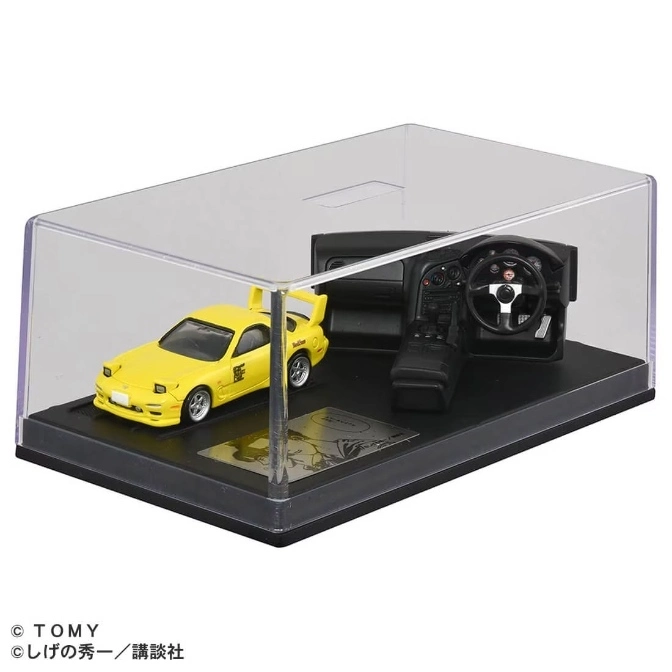 Yellow toy car and interior display in case. Supra model.