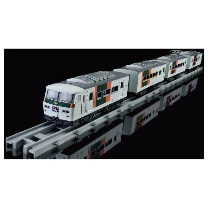  Toy train set with white and green cars on gray tracks, reflecting on a black surface.
