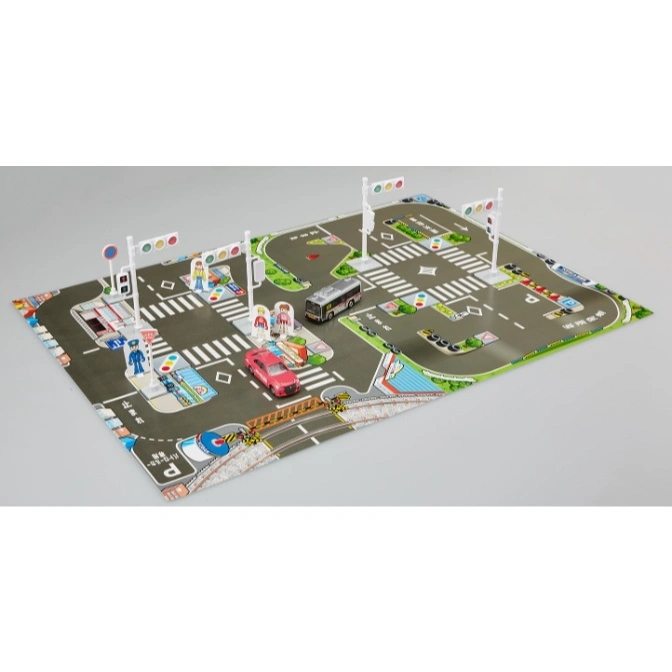 Toy city playset with cars, bus, traffic lights, and pedestrian figures on a road map.