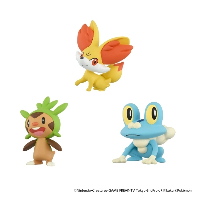  Three Pokémon figures: Fennekin, Chespin, and Froakie, posed against a white background.