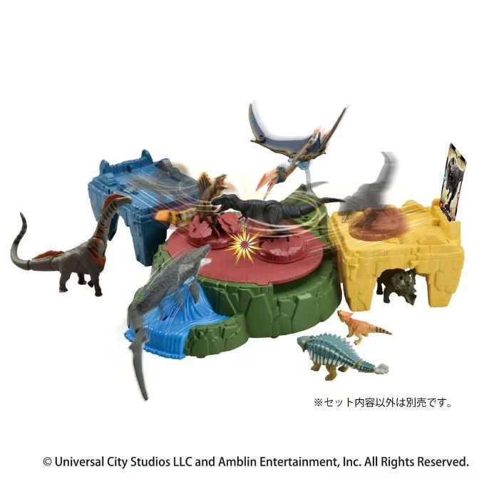 Dinosaur playset with various toy dinosaurs, including a long-necked dinosaur, pterodactyl, and ankylosaurus.