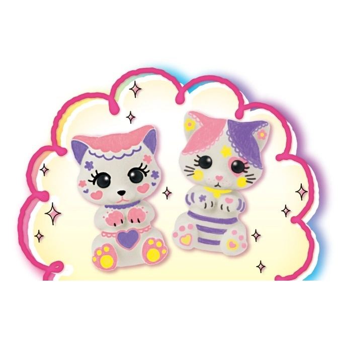  Two decorated ceramic cat figurines with colorful paint details, set against a cloud-shaped backdrop.