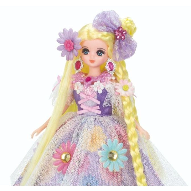  Licca-chan doll in a floral dress with a bow, flower accessories, and braided hair.