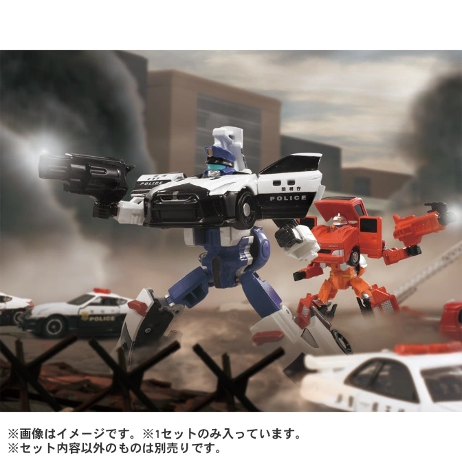  Police and fire truck transforming robots with guns in a city setting, part of a toy set.