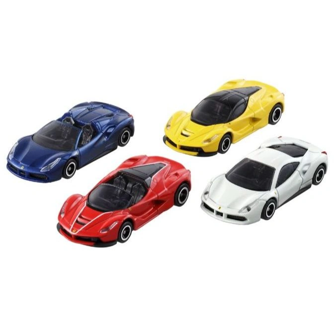 Four toy Ferrari cars in blue, red, yellow, and white. Miniature models.