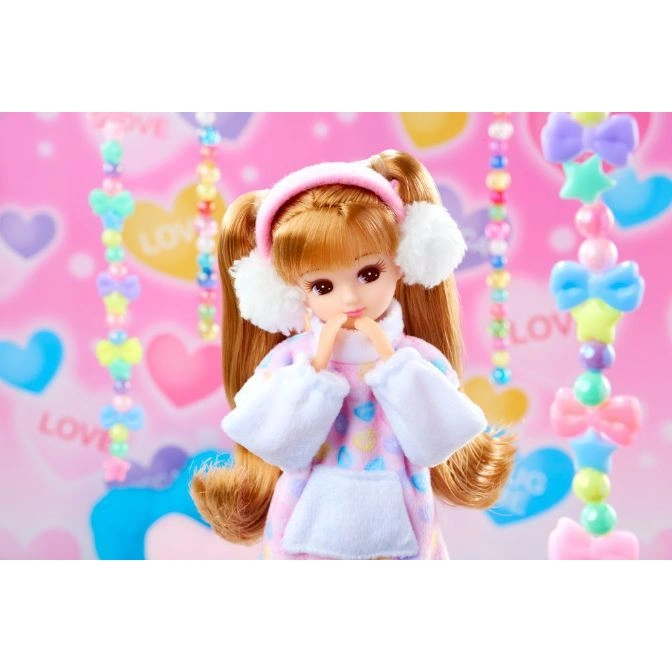  Doll with earmuffs, wearing a pastel hoodie. Cute, collectible toy.