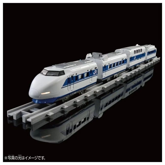 Toy Shinkansen bullet train on tracks, white with blue stripes, reflecting on a black surface.