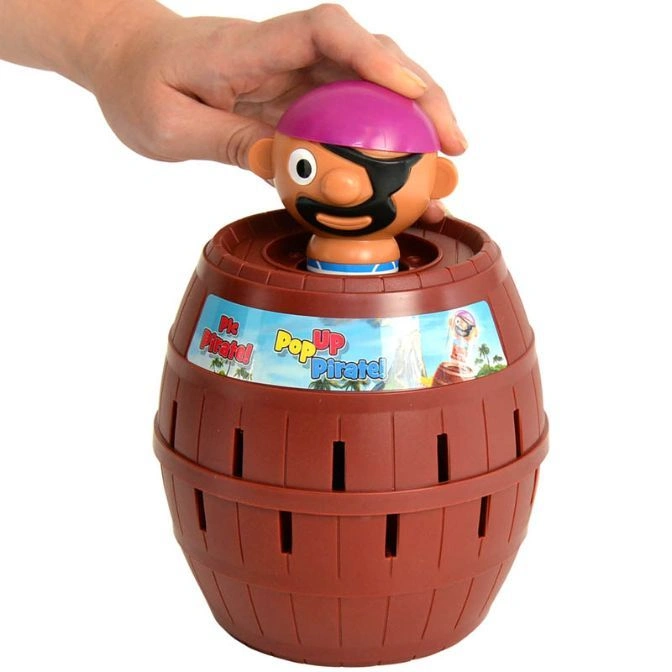  Pop-Up Pirate toy with a hand pressing down the pirate into the barrel.