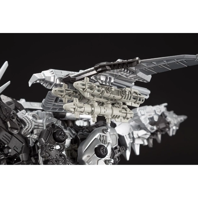 Silver robot toy with missile launchers and wing-like structures, detailed mechanical design.