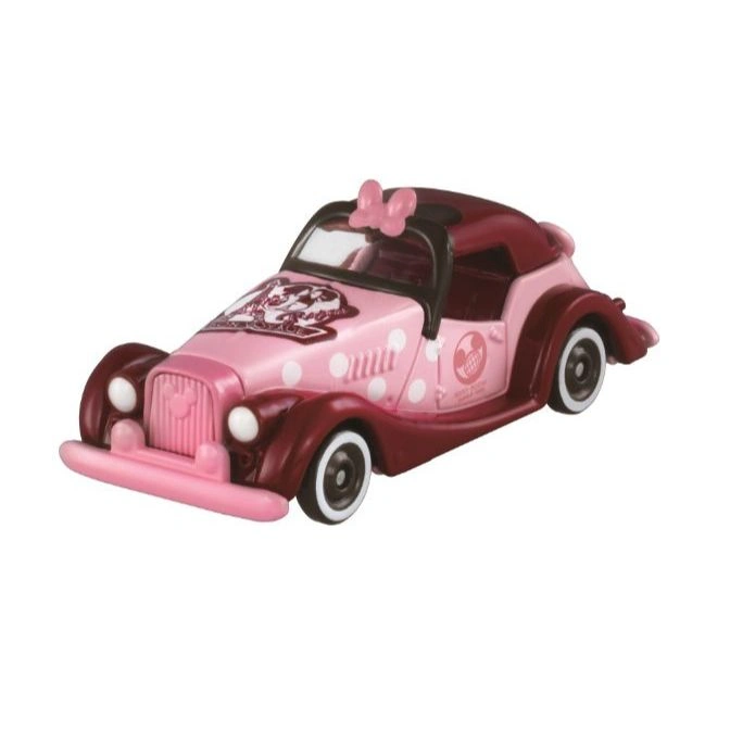 Pink Minnie Mouse toy car with polka dots and a bow.