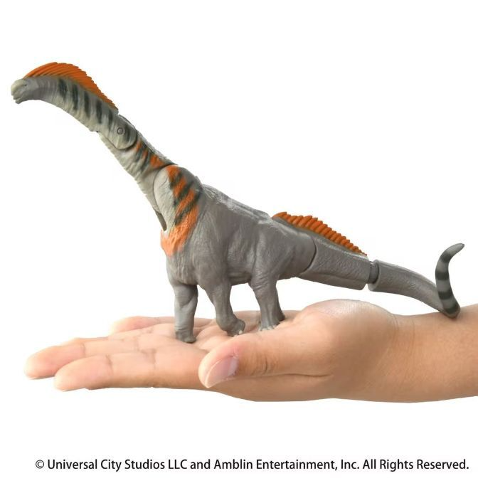  Grey dinosaur toy with orange stripes on a hand. It has a long neck and tail.