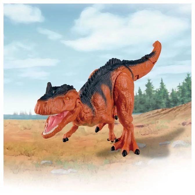  Orange toy dinosaur with black markings and open mouth standing on a sandy surface.