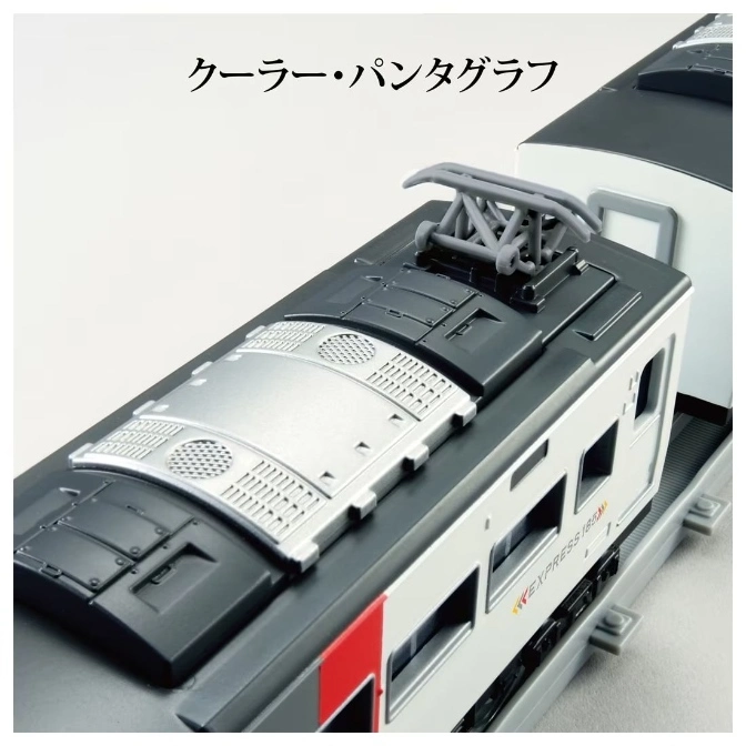  Toy train with pantograph and silver roof detail on a track.