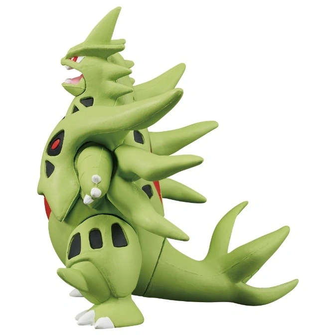  Green Tyranitar toy figure with spikes and tail, standing in a side profile.
