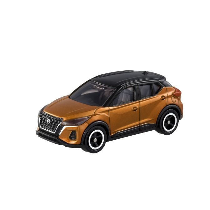 Orange and black toy Nissan Kicks SUV with detailed wheels.