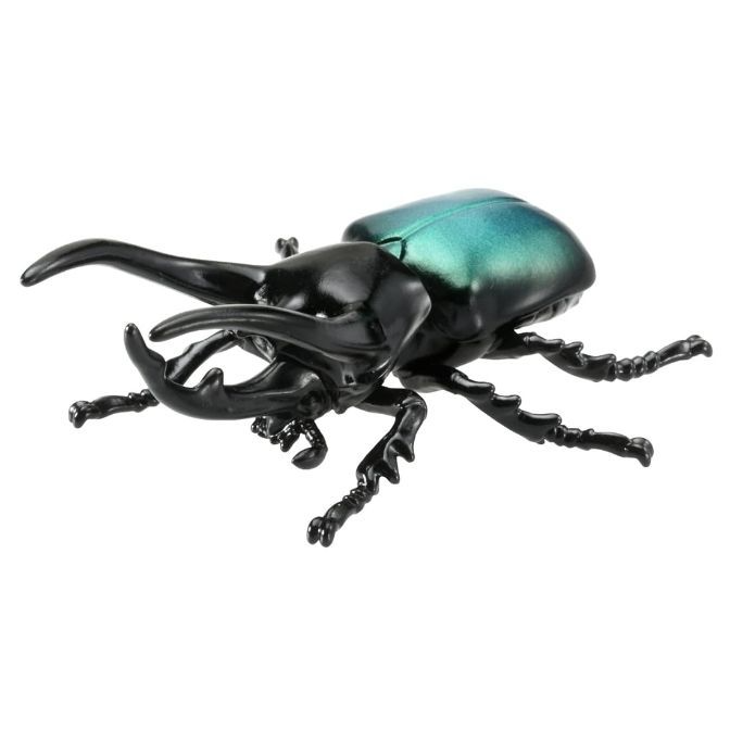 Toy beetle with large mandibles and iridescent green shell.
