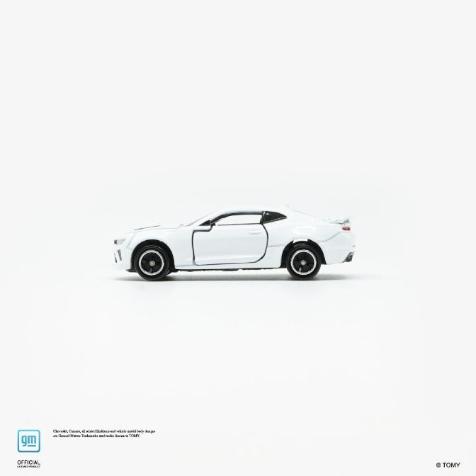  White toy car, a Chevrolet Camaro, with black wheels and a spoiler.