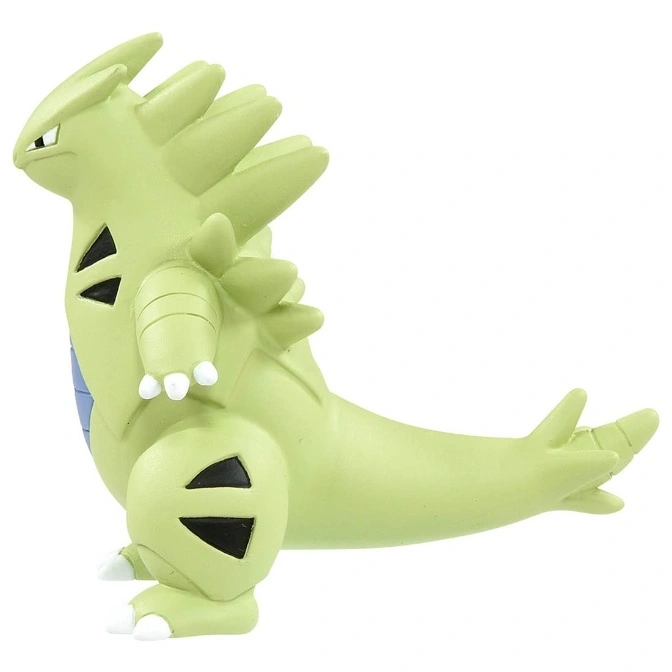  Tyranitar toy figure, light green with spikes, standing in profile.